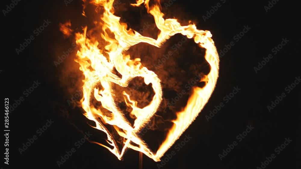Burning hearts on the feast day of St. Valentine. A symbol of love. Slow motion.