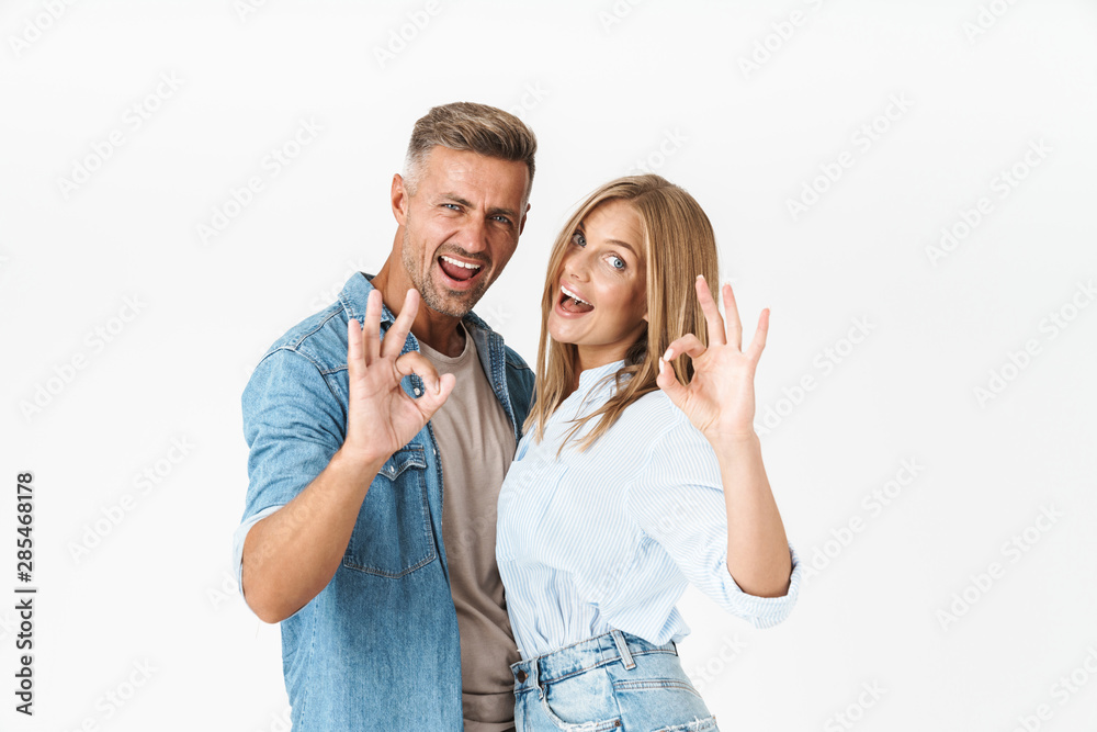 Pretty young couple wearing casual clothing standing Pretty young couple wearing casual clothing standing