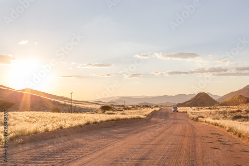 Sunset drive through desert landscape