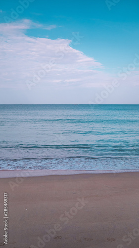 Sea beach sand clouds on light background. © Aleksandr