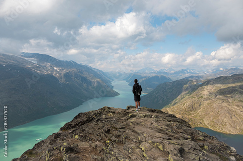 Jotunheimen National Park, Person standing on top of Besseggen looking over the Gjende Fjord photo