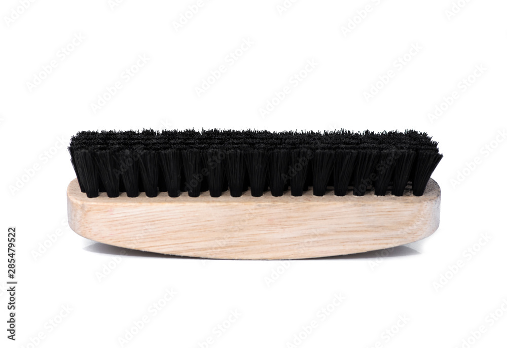 Wooden shoe brush with black fur for cleaning shoes isolated on white background. Side view Wooden shoe brush with black fur for cleaning shoes isolated on white background. Side view