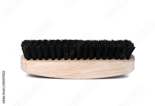 Wooden shoe brush with black fur for cleaning shoes isolated on white background. Side view