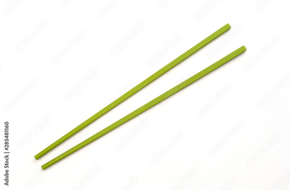 Green chopstick isolated on a white background, Top view Green chopstick isolated on a white background, Top view