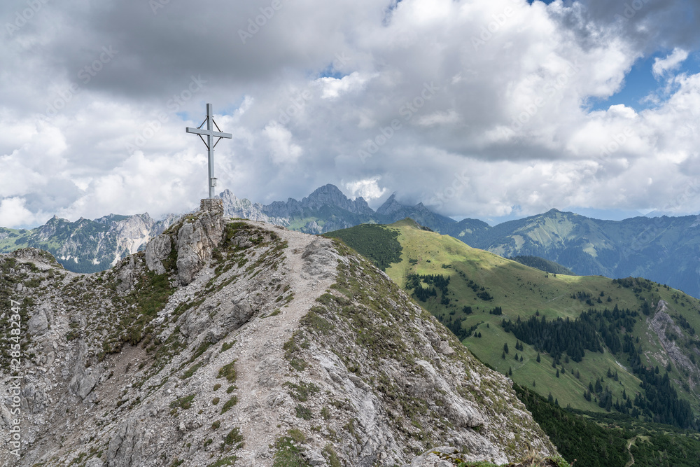 Fototapeta premium approaching the summit of Litnis Schrofen during a bike and hike adventure in the Tannheim Valley, Tirol Austria