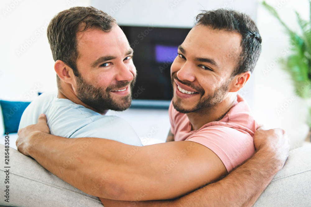 Fototapeta premium Portrait of a Cute Male gay homosexual Couple at Home