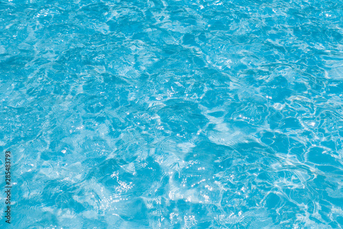 Beautiful ripple wave and blue water surface in swimming pool, Blue sea background and abstract © peangdao