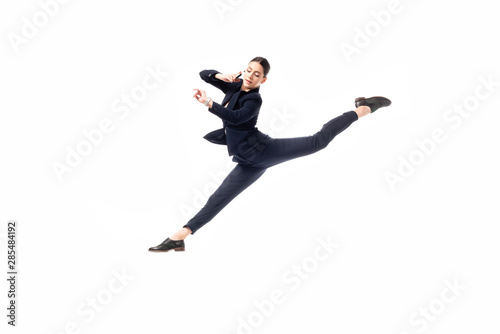 graceful businesswoman talking on smartphone and looking at watch while levitating in dance isolated on white © LIGHTFIELD STUDIOS