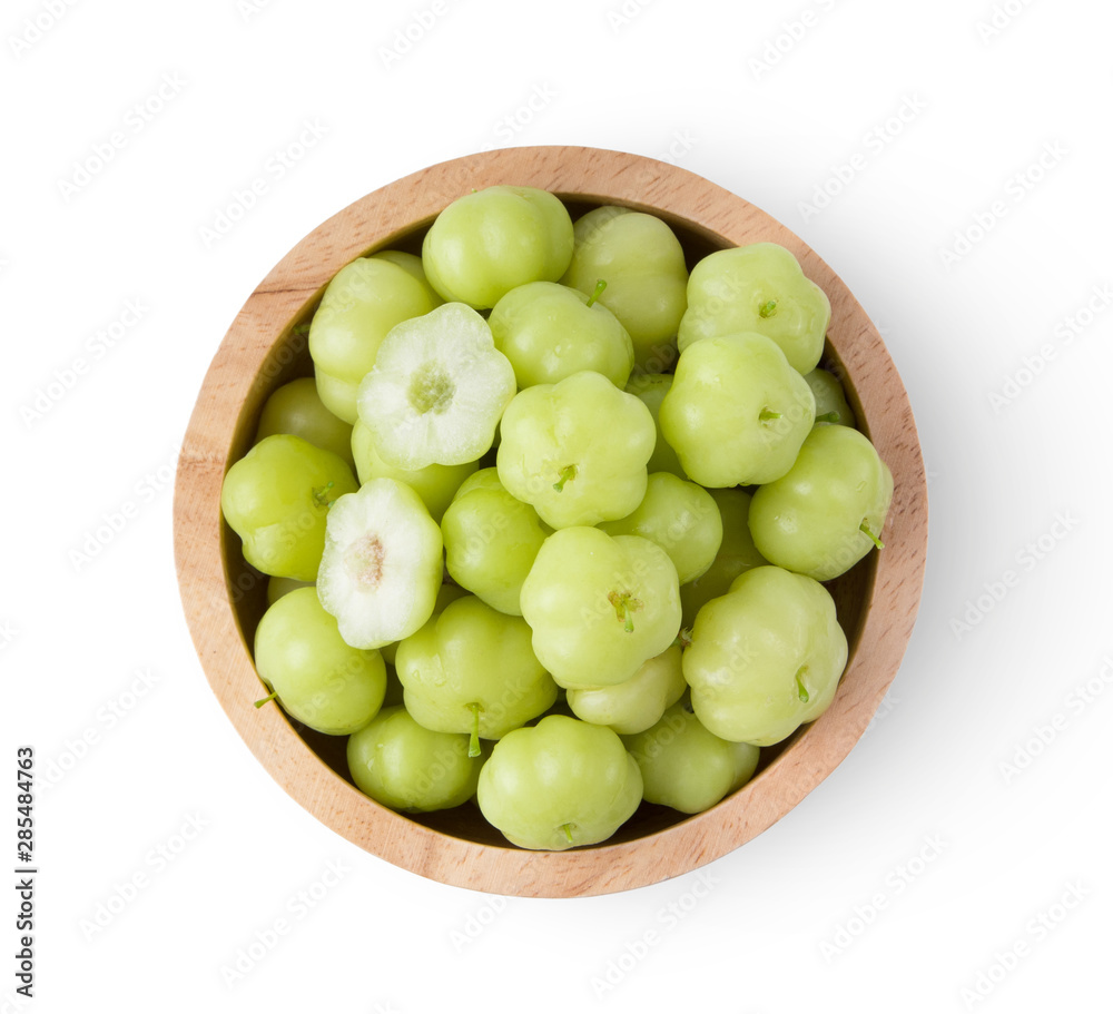 star gooseberry in wood bowl isolated on white background. top view star gooseberry in wood bowl isolated on white background. top view