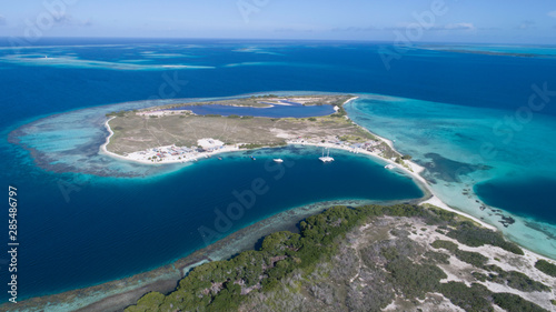 Caribbean: Vacation in the blue sea and deserted islands. Aerial view of a blue sea with crystal water. Great landscape. Beach scene. Aerial View Island Landscape Los Roques photo