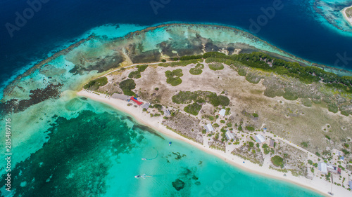 Caribbean: Vacation in the blue sea and deserted islands. Aerial view of a blue sea with crystal water. Great landscape. Beach scene. Aerial View Island Landscape Los Roques photo