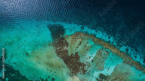 Caribbean  Vacation in the blue sea and deserted islands. Aerial view of a blue sea with crystal water. Great landscape. Beach scene. Aerial View Island Landscape Los Roques