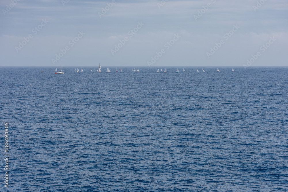 Splendid panoramic view of the crystal blue sea of the island of Elba in Italy with boats on the horizon