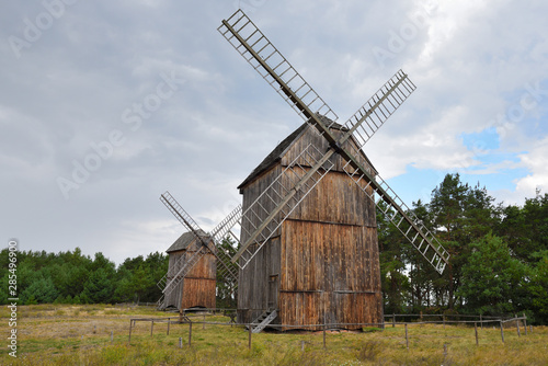 Old wooden windmills in The Folk Culture Museum in Osiek by the river Notec, the ethnographic park covers an area of 13 ha. Poland, Europe