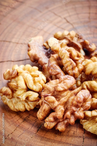 Close up picture of walnuts on a wooden table, selective focus.