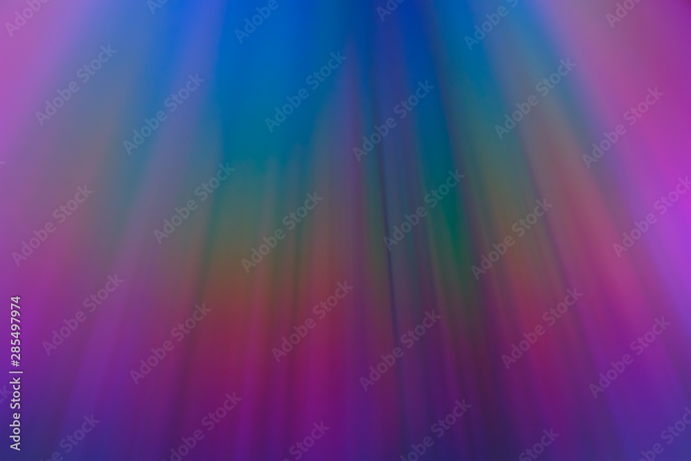 Neon rainbow streaks, blurred multicolor beams. Abstract background