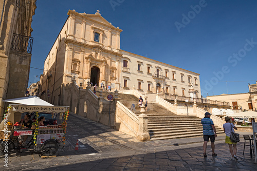 Scenic entrance stairway and façade of the baroque church of S. Francesco d'Assisi and Monastery of S. Salvatore in Noto, Sicily Italy.