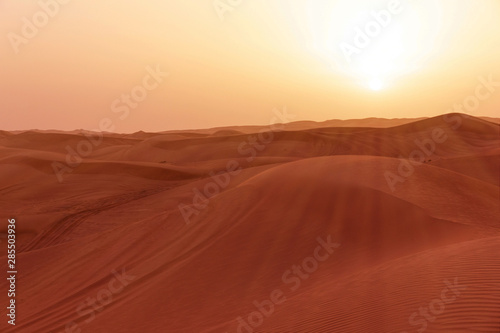 Sand desert sunset landscape with sun rays