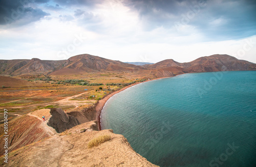 The black sea coast in the Crimea, in Koktebel on the Cape Chameleon at sunset