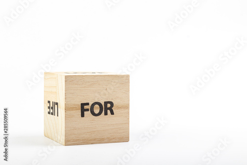 Wooden cubes with the inscription for on a white background