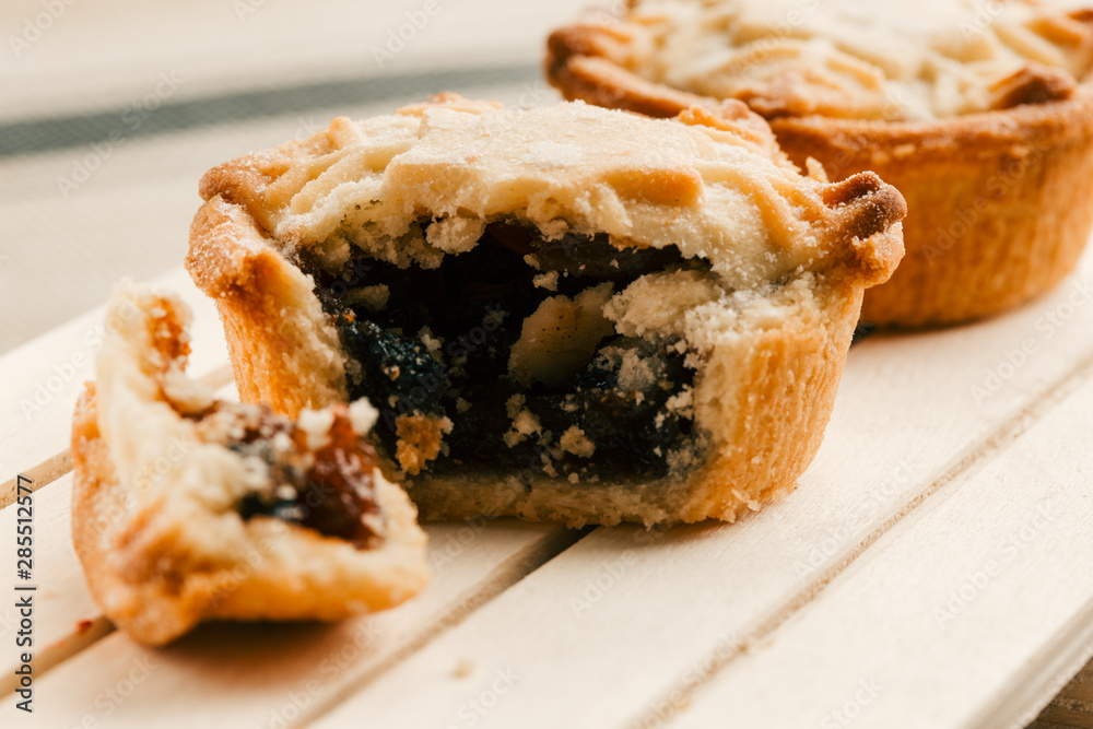 Homemade mince pie with blueberry jam filling on the board Homemade mince pie with blueberry jam filling on the board