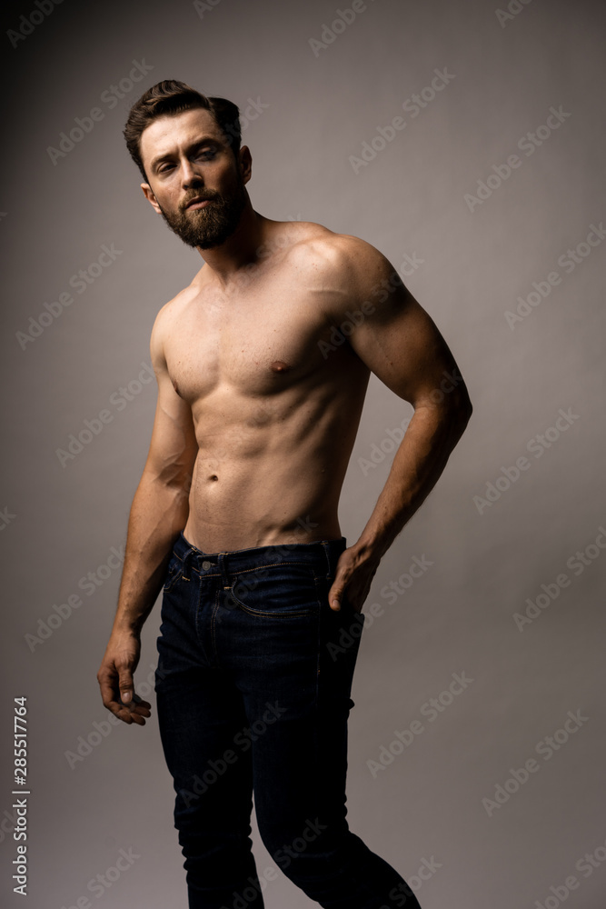 Pressure work stress business concept a lot of issues. A handsome topless man under pressure. Putting something in his back pocket. Pressure work stress business concept a lot of issues. A handsome topless man under pressure. Putting something in his back pocket.