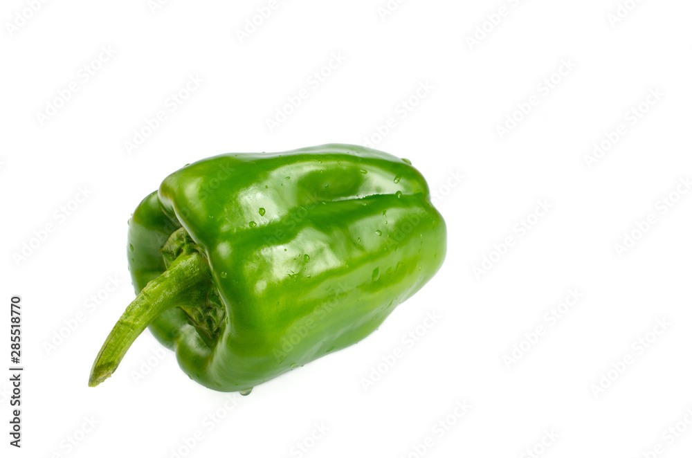 Green vegetable. One pepper isolated on the white background. With space for text. Green vegetable. One pepper isolated on the white background. With space for text.