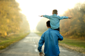 father and son walk in nature
