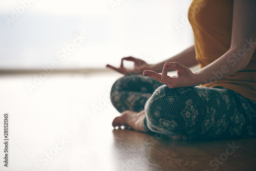 Fototapeta Naklejka Na Ścianę i Meble -  Female Padmasana mudra yoga flow