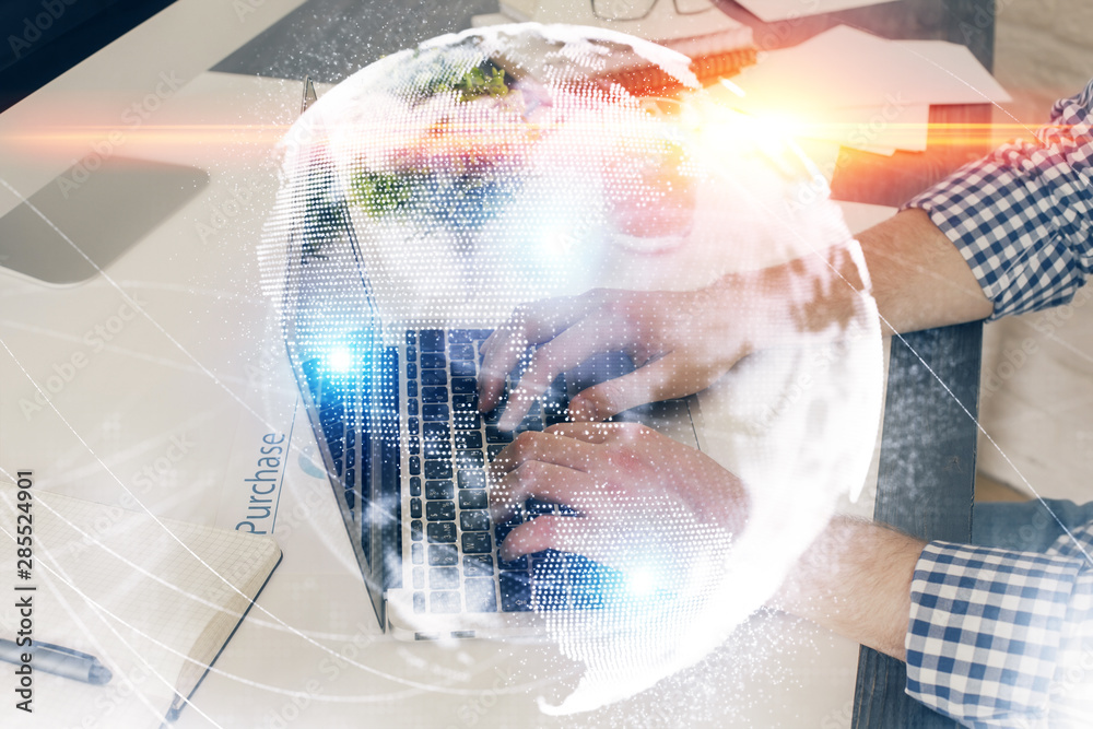 Double exposure of businessman working on laptop on background. International business hologram in front. Concept of success. Double exposure of businessman working on laptop on background. International business hologram in front. Concept of success.