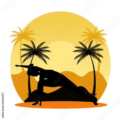 silhouette of woman practicing pilates on the landscape sunset scene