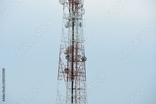 Microwave system.Wireless Communication Antenna With bright sky.Telecommunication tower with antennas.High pole for signal transmission.
