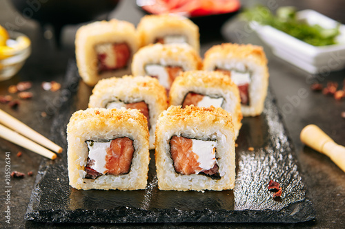 Crispy Tempura Maki Sushi Rolls or Uramaki with Raw Salmon