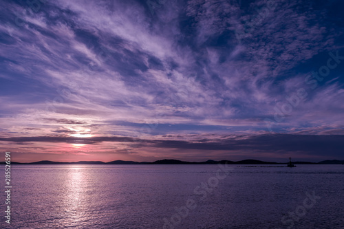sunset over the sea, cirrus and cirrostratus clouds
