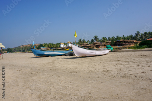 Two fishing boats on the beach in Goa, India