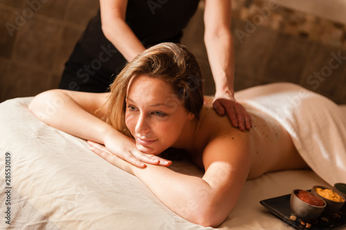 Beautiful young woman receiving a massage.