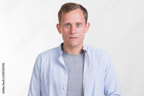 Portrait of a sad young man in unbuttoned shirt. © A Stock Studio