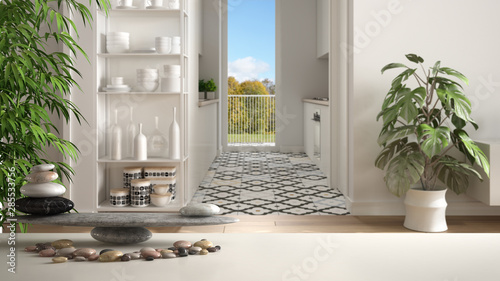 Fotografie White table shelf with pebble balance and 3d letters making the word feng shui o