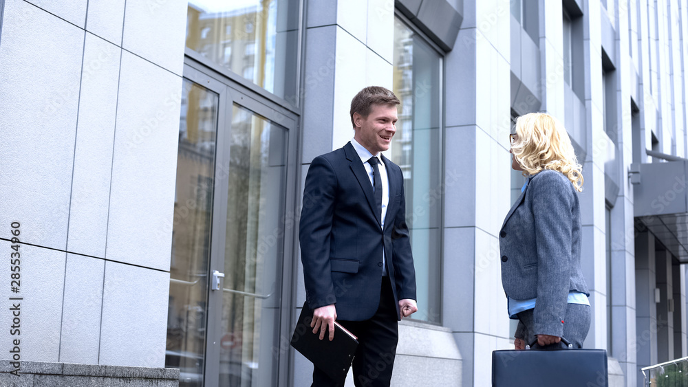 Male company employee talking to female boss, business proposal, initiative Male company employee talking to female boss, business proposal, initiative