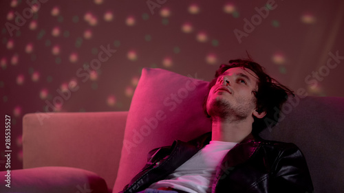 Tableau sur toile Drug abuse problem, intoxicated young man having nosebleed caused by cocaine