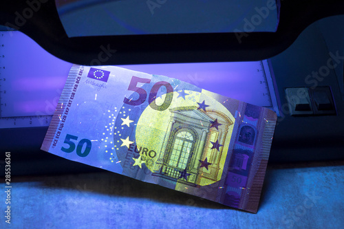 Banknote of 50 euros. authentication. close-up. there is tinting
