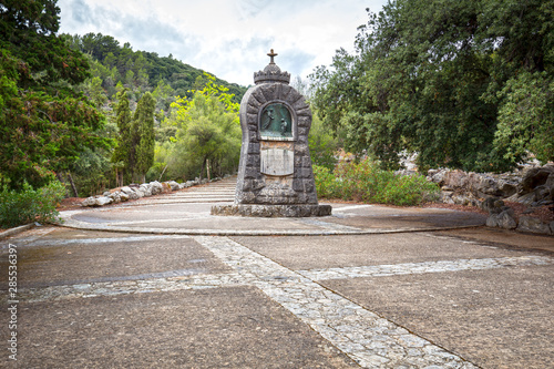 Monument with cross on Lluc Monastery, Mallorca, Spain photo