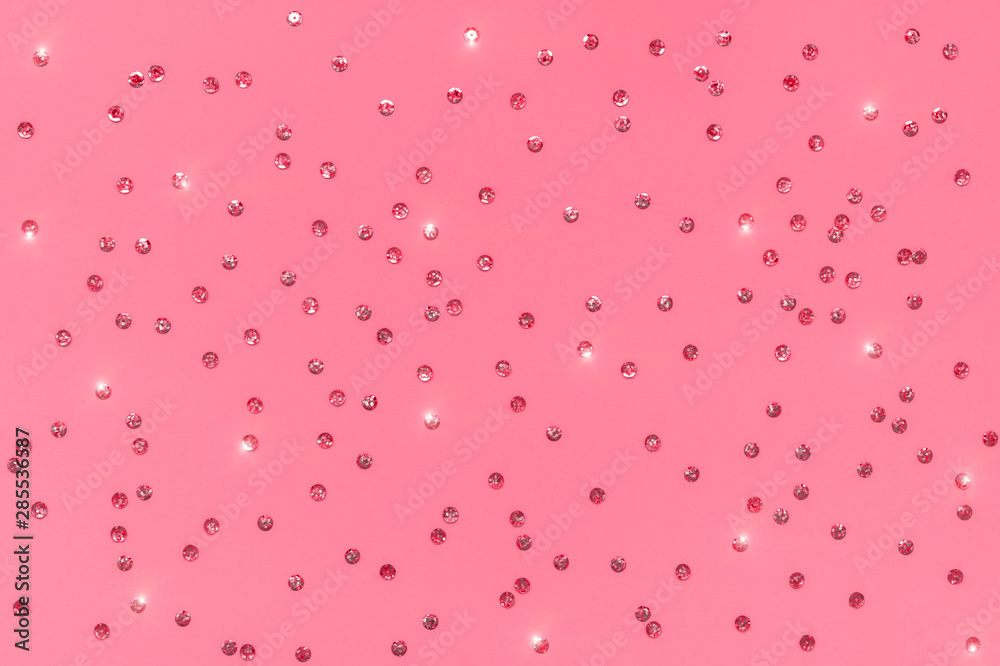 Confetti sprinkles on backdrop in Fruit Dove color with shine effect. Trendy color of 2019-2020. Festive holiday background. for your projects. Celebration concept. Christmas pattern. Top view Confetti sprinkles on backdrop in Fruit Dove color with shine effect. Trendy color of 2019-2020. Festive holiday background. for your projects. Celebration concept. Christmas pattern. Top view