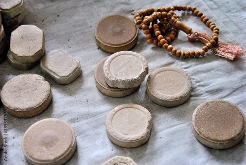 Clay turbahs and misbaha (tasbih) used for prayer by Muslims photo