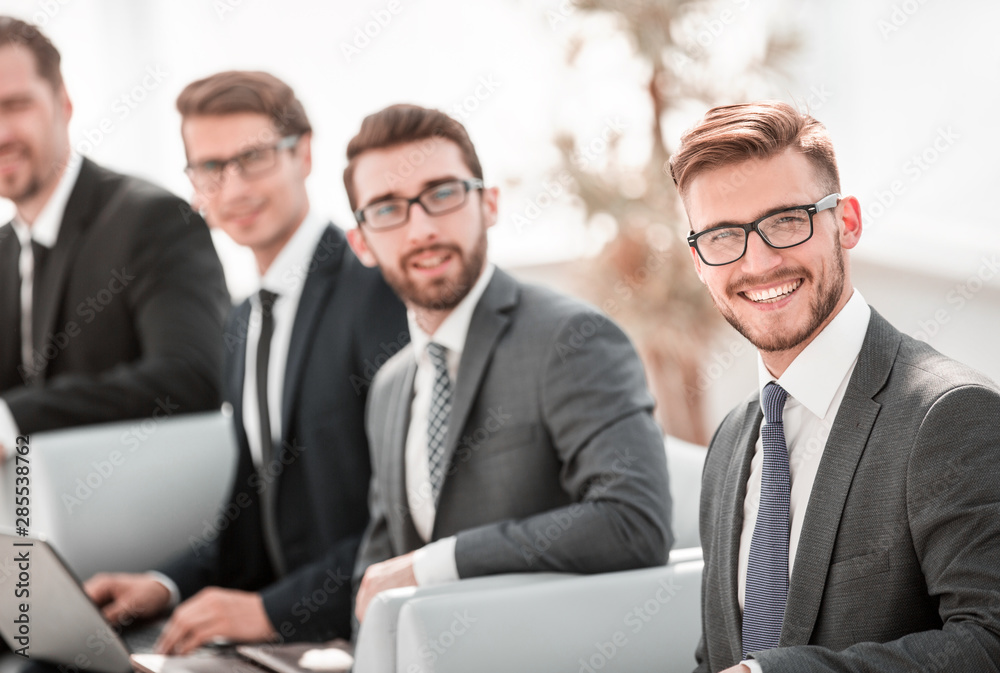 businessman and a group of colleagues waiting for the start of a business meeting businessman and a group of colleagues waiting for the start of a business meeting