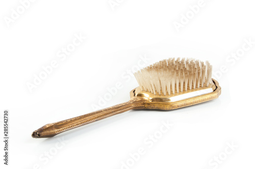 Antique hair brush on white