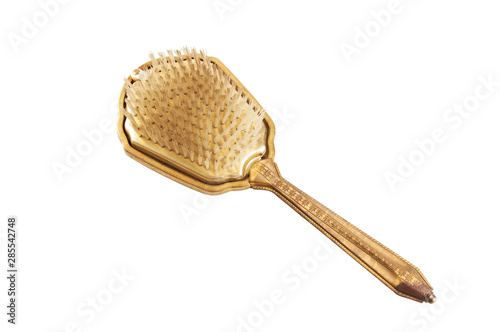 Antique hair brush close up isolated on white