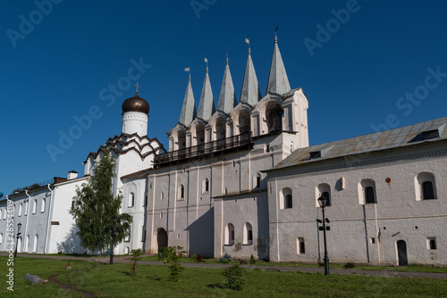 The belfry and the Church of the Protection of the Holy Virgin in Tikhvin Assumption (Assumption) monastery. Tikhvin, Russia photo