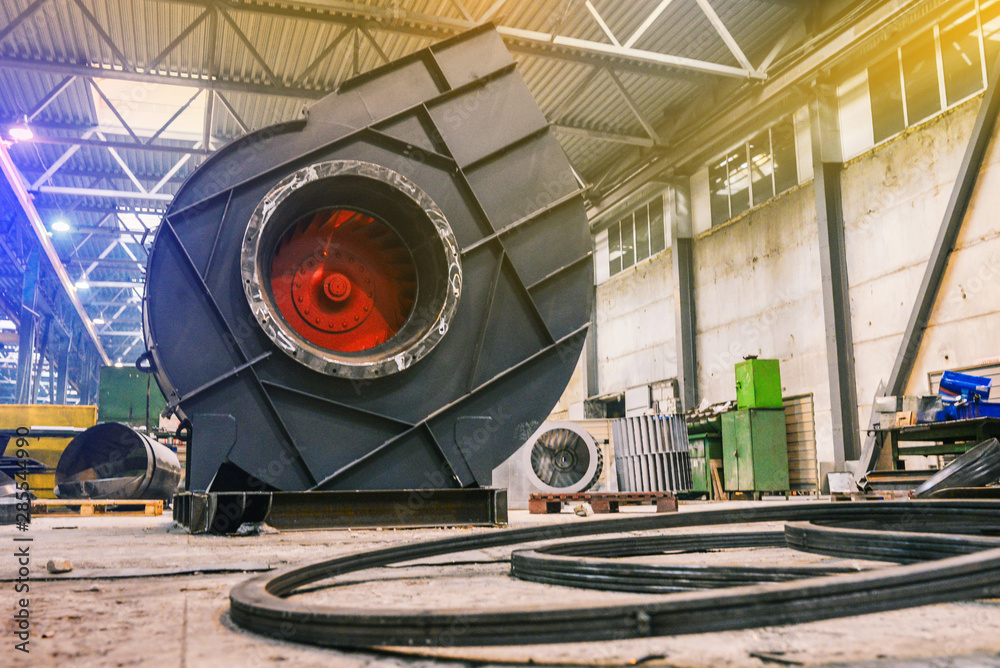 The manufacture of an industrial exhaust fan at an industrial plant.  Traction fan assembly. Industrial ventilation system. Metallurgical and  parts manufacturing Stock-foto | Adobe Stock