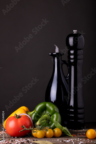 Levitating sandwich with levitating parts of food. Kanpka on a beautiful wooden table decorated with salt with pepper and kitchen utensils  photo